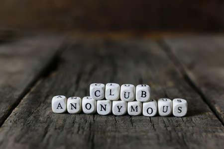small wooden blocks with letters on the old worn wooden tableの写真素材