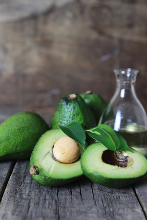 ripe juicy buttery avocado on a wooden table old textural