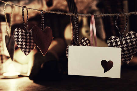 decoration with a symbol of warmth and love of a small paper heartの写真素材