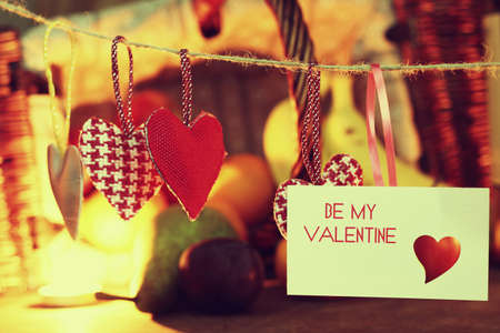 decoration with a symbol of warmth and love of a small paper heartの写真素材