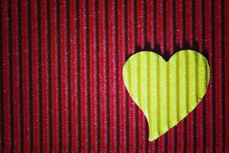 decoration with a symbol of warmth and love of a small paper heartの写真素材