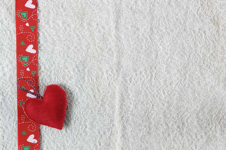 decoration with a symbol of warmth and love of a small paper heartの写真素材