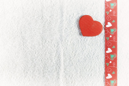 decoration with a symbol of warmth and love of a small paper heartの写真素材