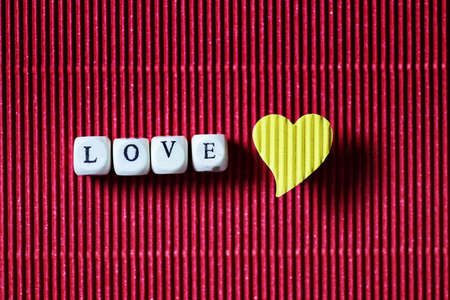 decoration with a symbol of warmth and love of a small paper heartの写真素材