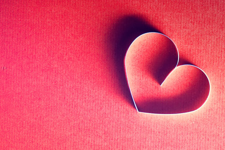 decoration with a symbol of warmth and love of a small paper heart