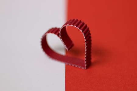 decoration with a symbol of warmth and love of a small paper heartの写真素材