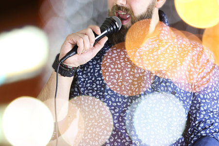 close-up portrait of a handsome bearded man posing on cameraの写真素材