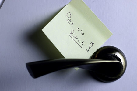 Note by the door Pay Rent