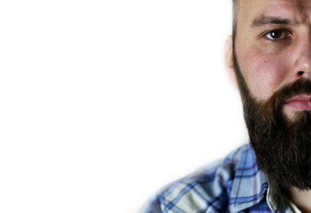 close-up portrait of a handsome bearded man posing on camera