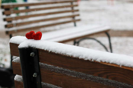 Snowy day shape of hearts red color in winter dayの写真素材
