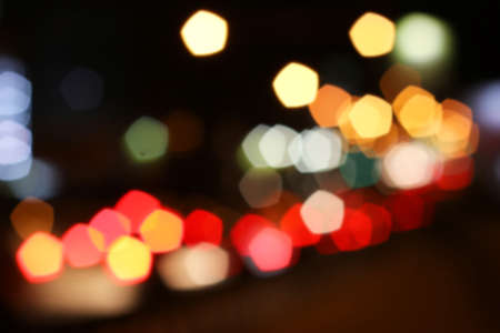 background blurred city lights of different colors at nightの写真素材