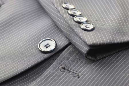 four gray buttons sewn on the sleeve men's suit systemの写真素材