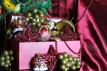 decorated with a satin cloth festive table with glasses of wine and a dressed Christmas treeの写真素材