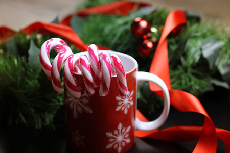 Christmas sweet cane sticks with satin ribbon tied aroundの写真素材