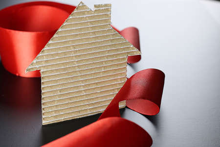 satin ribbon on a black matte background and the shape of the heartの写真素材