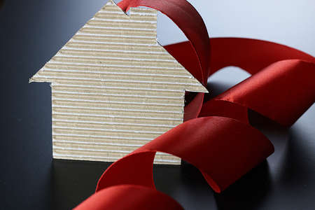 satin ribbon on a black matte background and the shape of the heartの写真素材