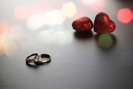 satin ribbon on a black matte background and the shape of the heartの写真素材