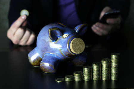 a lot of stacks of coins increasing yellow gradually the concept of progress and growthの写真素材