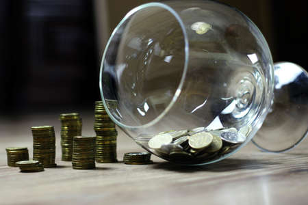 a lot of stacks of coins increasing yellow gradually the concept of progress and growthの写真素材