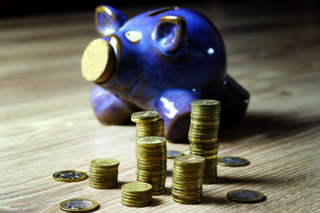 a lot of stacks of coins increasing yellow gradually the concept of progress and growthの写真素材