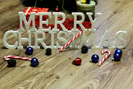 Christmas background celebration inscription wooden letters and Christmas toysの写真素材