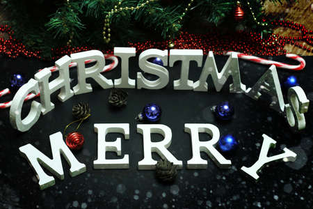 Christmas background celebration inscription wooden letters and Christmas toysの写真素材