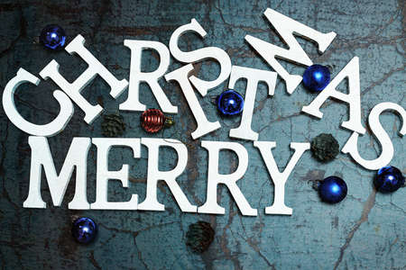 Christmas background celebration inscription wooden letters and Christmas toysの写真素材