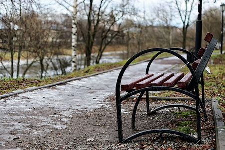 late autumn with the rainy weather in the city park at the church buildingの写真素材