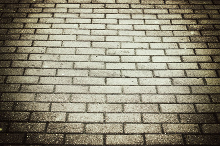 background and texture of a brick wall pavement with natural daylightの写真素材