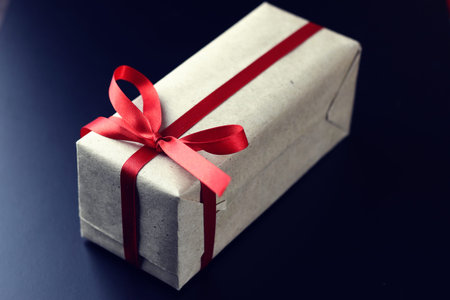 Christmas greetings and gifts on a black matte background wallpaperの写真素材