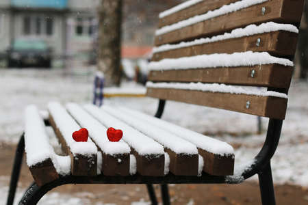 Snowy day shape of hearts red color in winter dayの写真素材