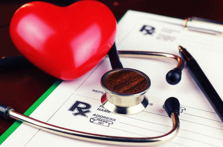 Medical stethoscope and office tablet with a prescription for medicineの写真素材