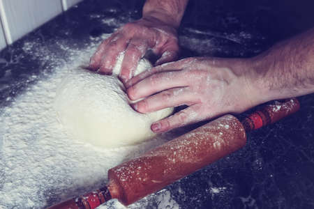 Food crumbly dough from flour on the chef's table with the help of a rolling pinの写真素材