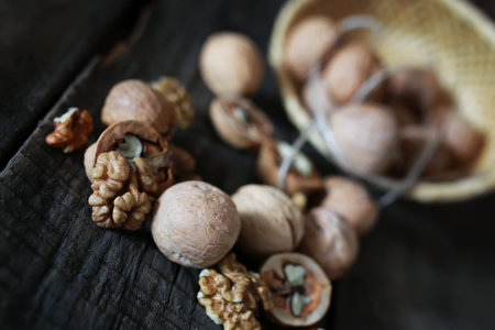 Dried chopped walnuts on a wooden background old shabby