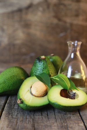 ripe juicy buttery avocado on a wooden table old textural