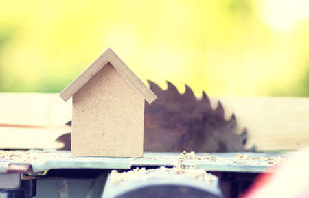 small wooden toy house and building inventory concept construction workの写真素材