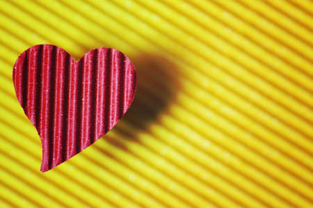 decoration with a symbol of warmth and love of a small paper heartの写真素材