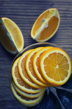 toned orange fruit on wooden backgroundの写真素材
