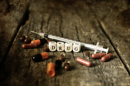 old shabby filthy Photo drug pill on wooden table concept addiction