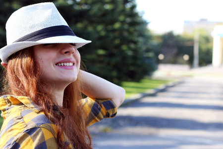 Pretty cute girl walks in the park on a sunny day