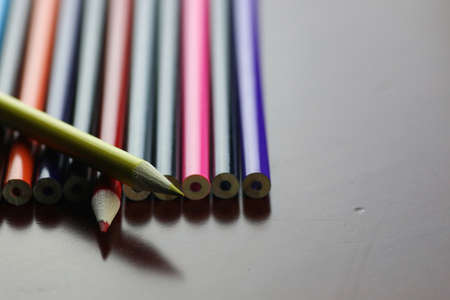 colored pencils on the wooden table concept of preparation for the new school yearの写真素材