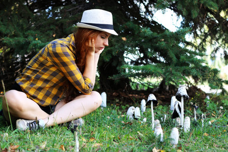 Pretty cute girl walks in the park on a sunny dayの写真素材