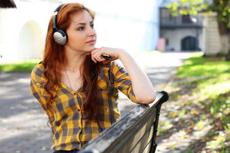 Pretty cute girl walks in the park on a sunny dayの写真素材