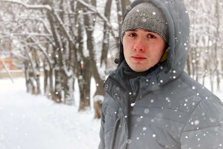 young student in a winter landscape on a sunny nice dayの写真素材