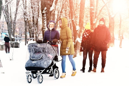 young student in a winter landscape on a sunny nice dayの写真素材