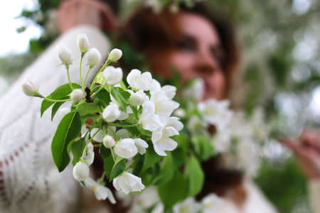 portrait of a happy young girl of European appearance with warm spring sunny dayの写真素材