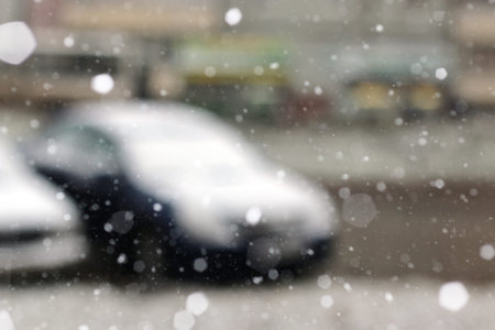 Winter in all its manifestations snow-covered streets of trees and lawnの写真素材