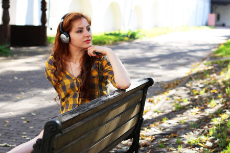 Pretty cute girl walks in the park on a sunny dayの写真素材