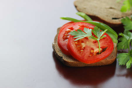 a sandwich bread tomato sauce green healthy vegetablesの写真素材