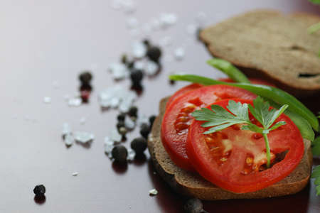a sandwich bread tomato sauce green healthy vegetablesの写真素材